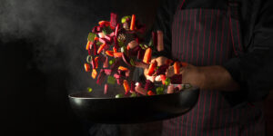 Cooking vegetables in a frying pan