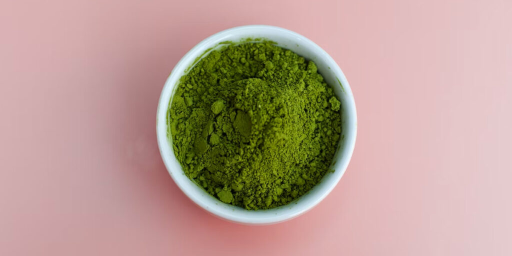 green powder in white ceramic bowl